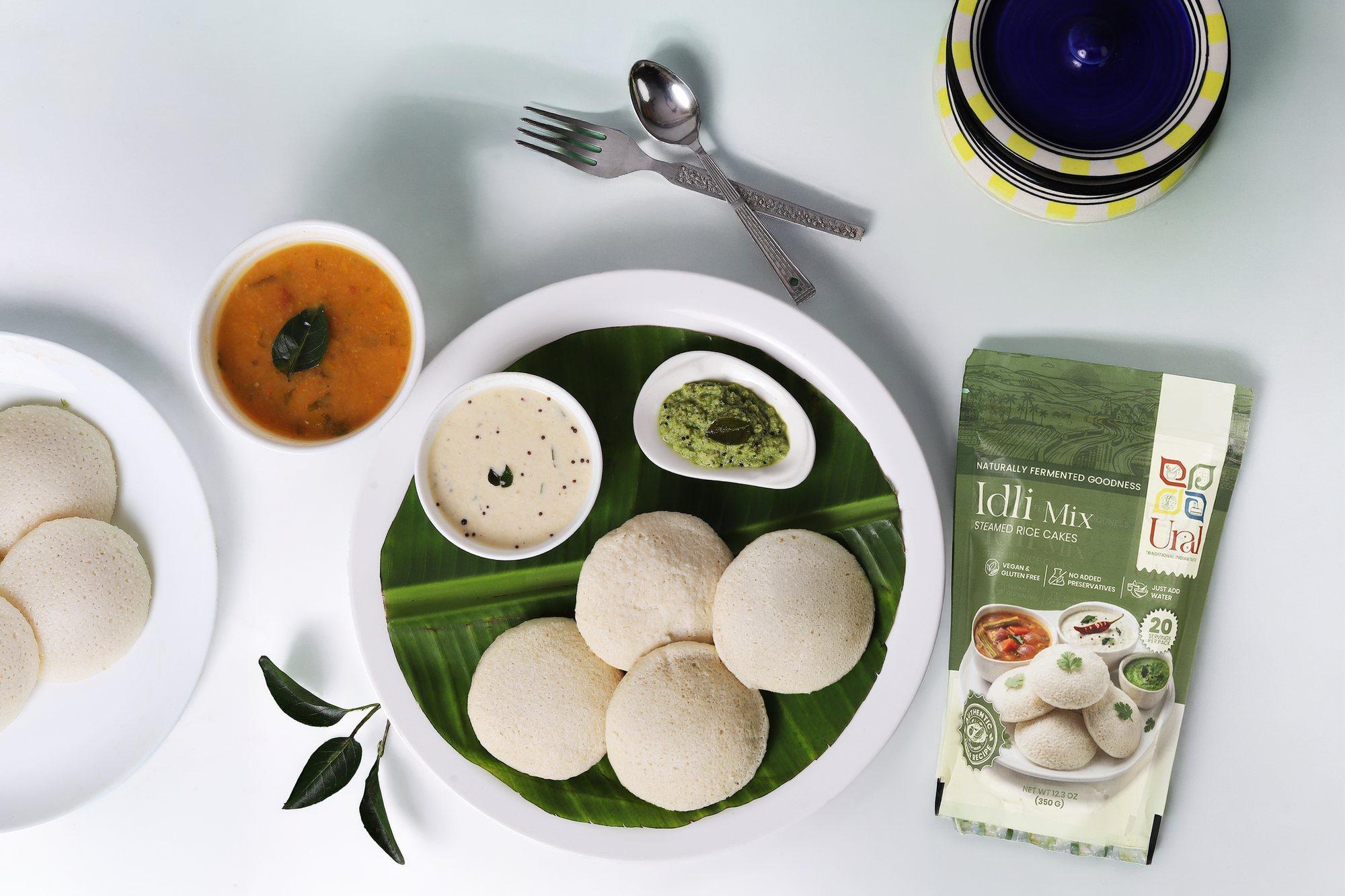 Soft steamed idlis served with chutney and sambar