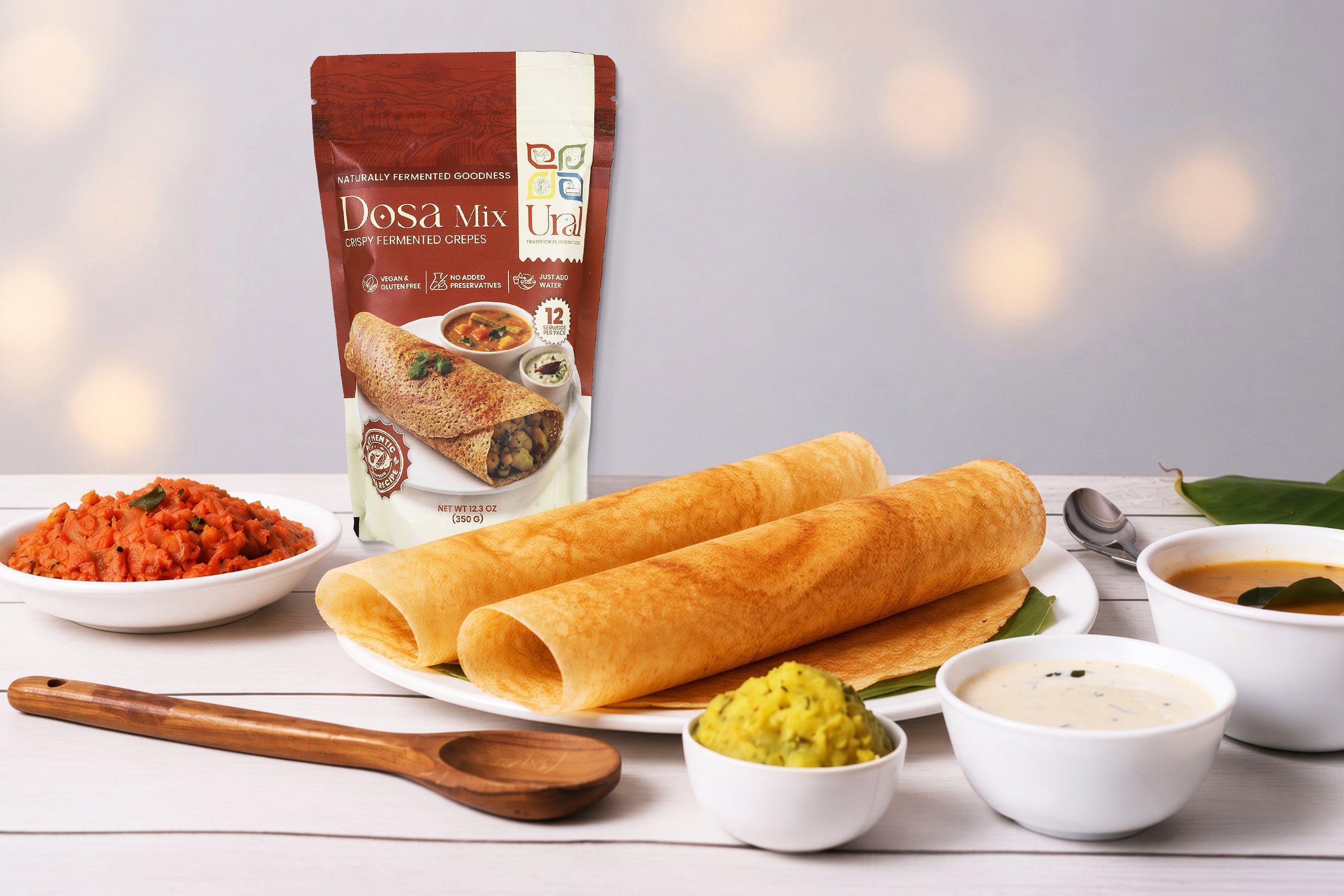 Fresh dosas and sambar on a rustic table